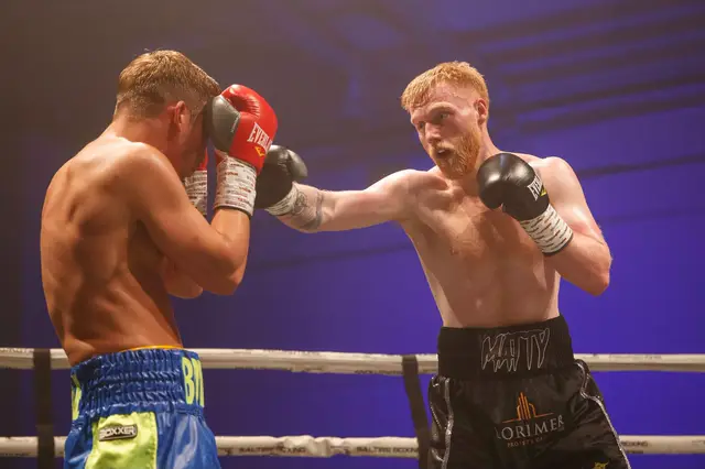 Matthew jabbing at an opponent who covers up