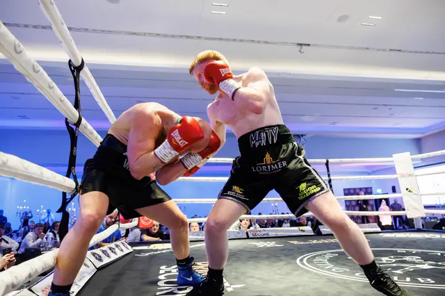 Matthew and his opponent exchanging at close range