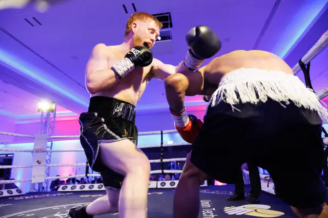 Matthew throwing a punch from a low crouch