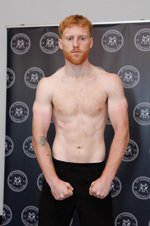 Matthew posing at a weigh-in