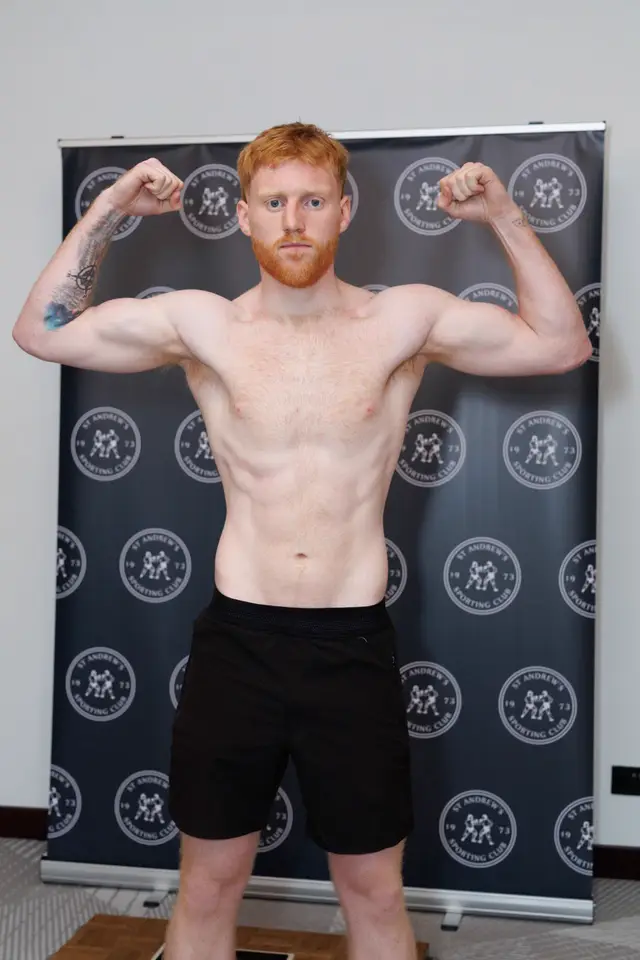Matthew flexing at a weigh-in